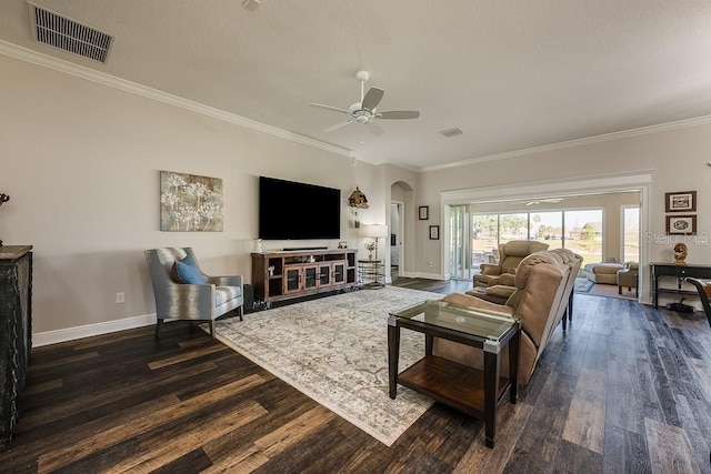 5729 Hickey Way, The Villages, FL 32163 - living room featuring dark wood finished floors, visible vents, arched walkways, and ceiling fan