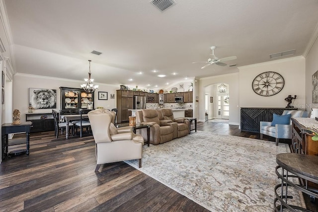 5729 Hickey Way, The Villages, FL 32163 - living room featuring arched walkways, ceiling fan with notable chandelier, and visible vents