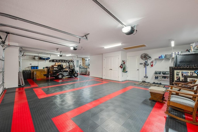5729 Hickey Way, The Villages, FL 32163 - garage featuring a garage door opener