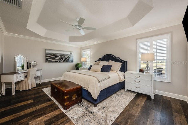 5729 Hickey Way, The Villages, FL 32163 - bedroom with a tray ceiling, baseboards, visible vents, and dark wood-type flooring