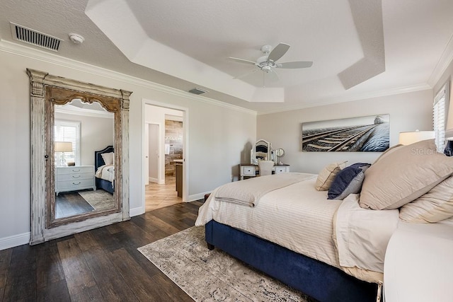 5729 Hickey Way, The Villages, FL 32163 - bedroom with visible vents, dark wood-style flooring, and a raised ceiling