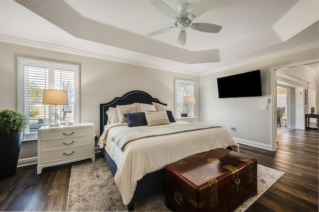 5729 Hickey Way, The Villages, FL 32163 - bedroom with dark wood-style flooring, a tray ceiling, multiple windows, and ornamental molding