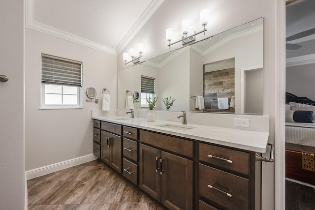 5729 Hickey Way, The Villages, FL 32163 - full bath with double vanity, crown molding, baseboards, and a sink