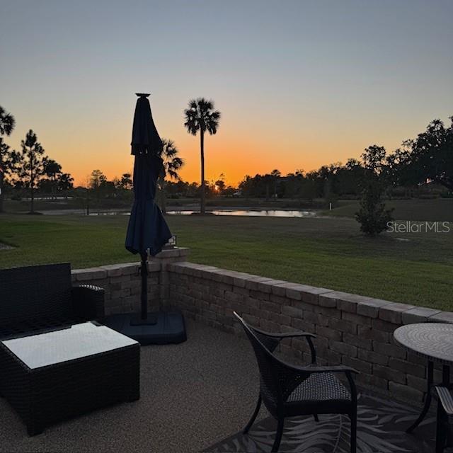 5729 Hickey Way, The Villages, FL 32163 - view of patio / terrace with a water view