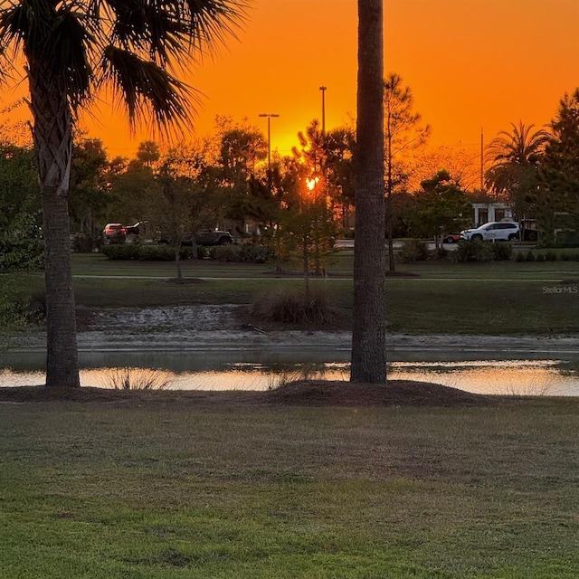 5729 Hickey Way, The Villages, FL 32163 - view of home's community featuring a lawn and a water view