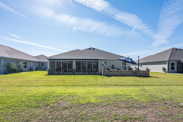5729 Hickey Way, The Villages, FL 32163 - back of house featuring a lawn and a sunroom