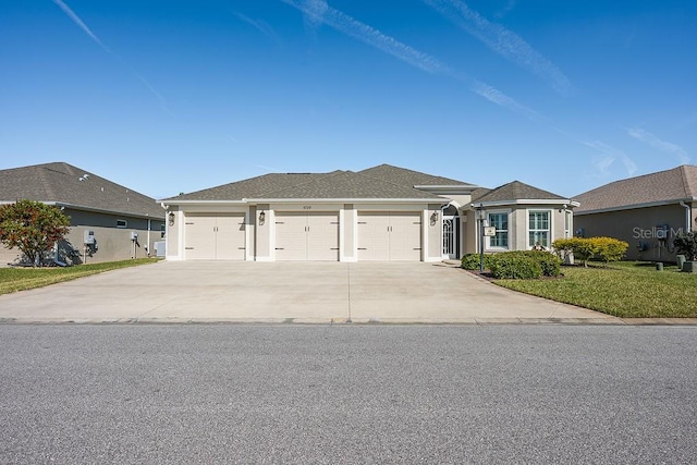 5729 Hickey Way, The Villages, FL 32163 - view of front of home featuring stucco siding, driveway, a garage, and a front lawn