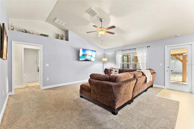 living room featuring a ceiling fan, light carpet, vaulted ceiling, and visible vents