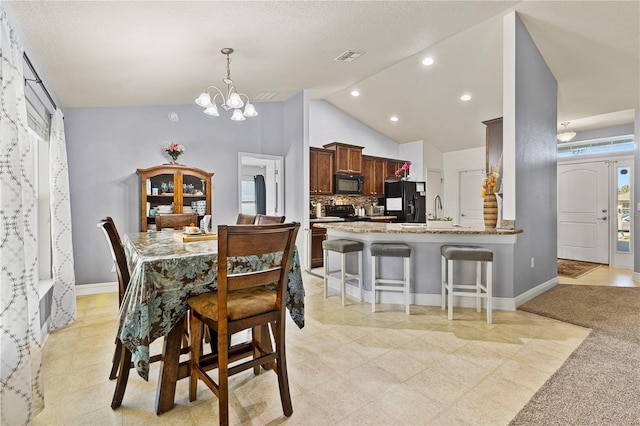 dining room featuring recessed lighting, a notable chandelier, baseboards, and visible vents