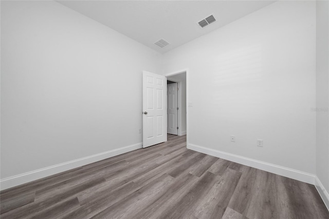 16407 SW 21st Terrace Rd, Ocala, FL 34473 - spare room with baseboards, visible vents, and wood finished floors