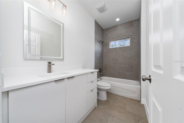 16407 SW 21st Terrace Rd, Ocala, FL 34473 - full bathroom with toilet, vanity,  shower combination, tile patterned flooring, and visible vents