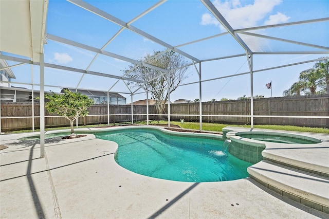 view of pool featuring a patio area, a fenced backyard, a pool with connected hot tub, and a lanai