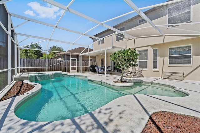 view of pool featuring a ceiling fan, glass enclosure, a patio area, fence, and a fenced in pool