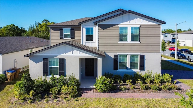 traditional-style home with stucco siding and board and batten siding