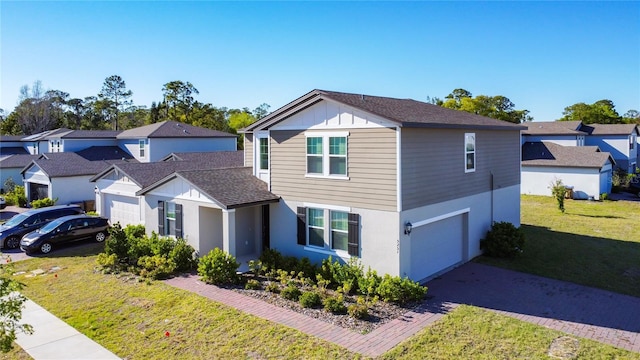 traditional-style home with stucco siding, a residential view, driveway, and a front lawn