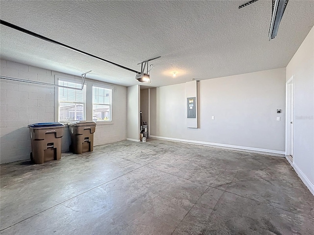 garage featuring electric panel, concrete block wall, and a garage door opener