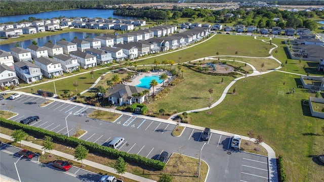 bird's eye view with a residential view and a water view
