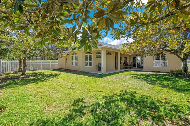 view of yard with a patio and fence