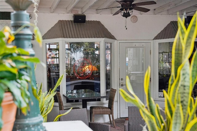 exterior space featuring beamed ceiling