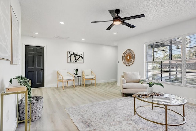 4907 21st Ave W, Bradenton, FL 34209 - sitting room with a wealth of natural light, a textured ceiling, ceiling fan, and wood finished floors