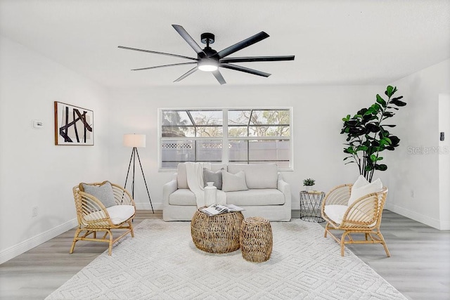 4907 21st Ave W, Bradenton, FL 34209 - living area featuring a ceiling fan, wood finished floors, and baseboards
