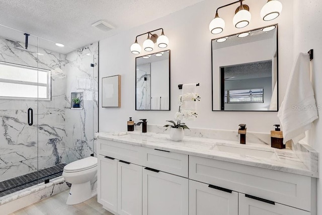 4907 21st Ave W, Bradenton, FL 34209 - full bath with a textured ceiling, toilet, a marble finish shower, and a sink