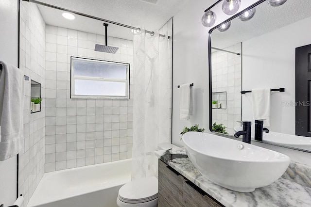 4907 21st Ave W, Bradenton, FL 34209 - bathroom featuring vanity, a textured ceiling, toilet, and shower / bath combination with curtain