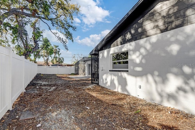 4907 21st Ave W, Bradenton, FL 34209 - view of side of property featuring concrete block siding and fence