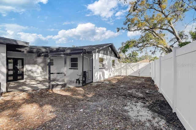 4907 21st Ave W, Bradenton, FL 34209 - view of side of home with a patio area, fence, and a gate