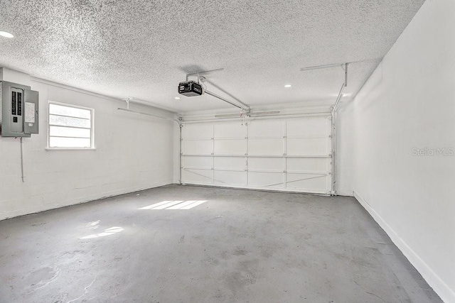 4907 21st Ave W, Bradenton, FL 34209 - garage with electric panel, a garage door opener, and baseboards