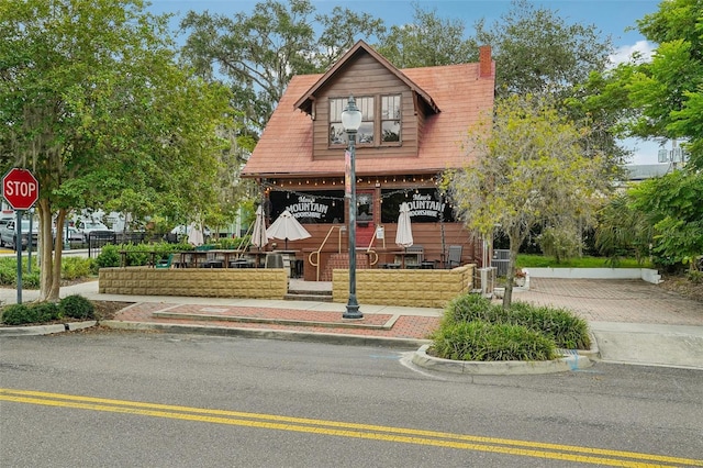view of front facade with a chimney