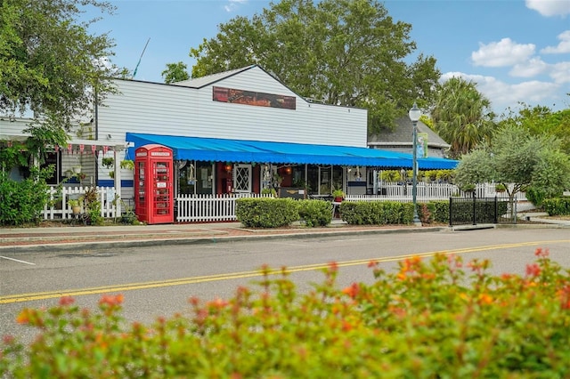 view of building exterior featuring fence
