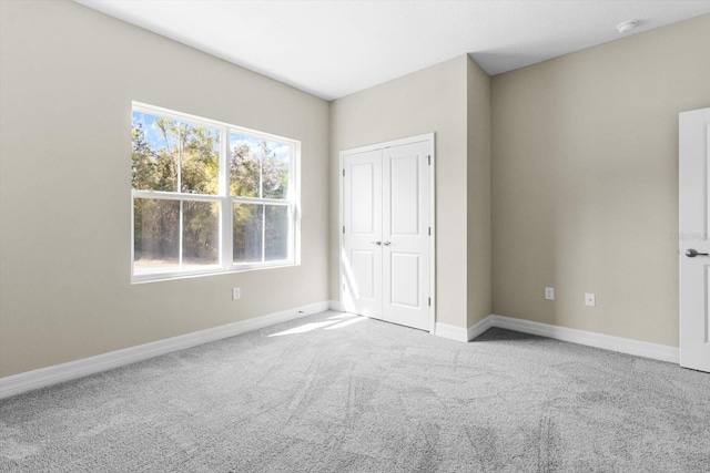 1973 E Celina St, Inverness, FL 34453 - unfurnished bedroom featuring carpet floors, baseboards, and a closet