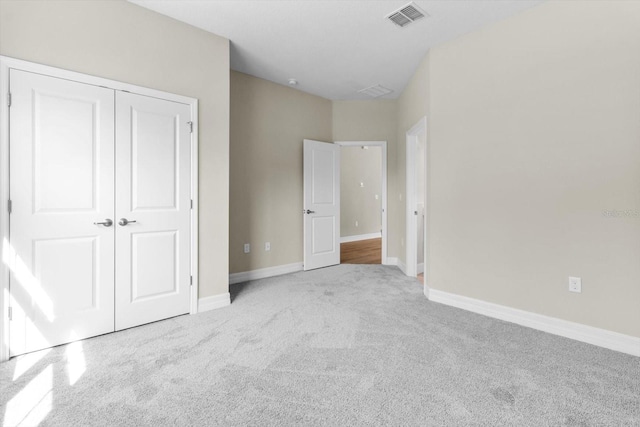 1973 E Celina St, Inverness, FL 34453 - unfurnished bedroom featuring carpet flooring, a closet, and baseboards