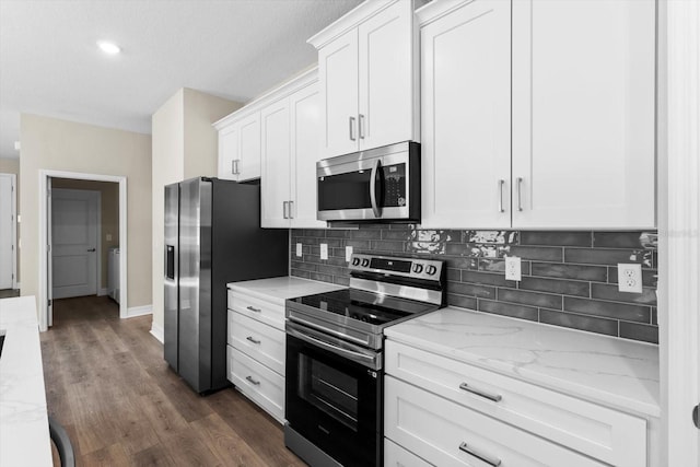 1973 E Celina St, Inverness, FL 34453 - kitchen featuring appliances with stainless steel finishes, white cabinetry, backsplash, light stone counters, and recessed lighting