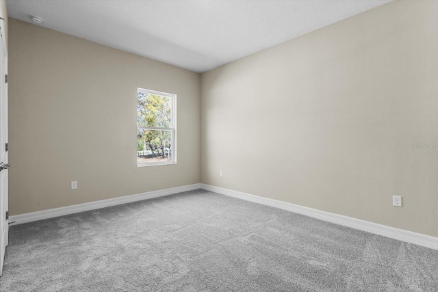 1973 E Celina St, Inverness, FL 34453 - empty room featuring carpet floors, a smoke detector, and baseboards