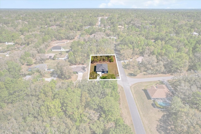 1973 E Celina St, Inverness, FL 34453 - aerial view of property's location with a heavily wooded area and property boundaries highlighted