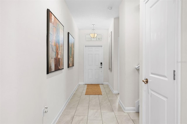 1551 Flange Dr, Davenport, FL 33896 - hall featuring light tile patterned floors and baseboards
