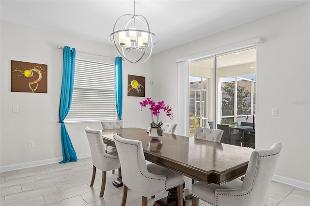 1551 Flange Dr, Davenport, FL 33896 - dining space featuring a wealth of natural light, baseboards, and an inviting chandelier