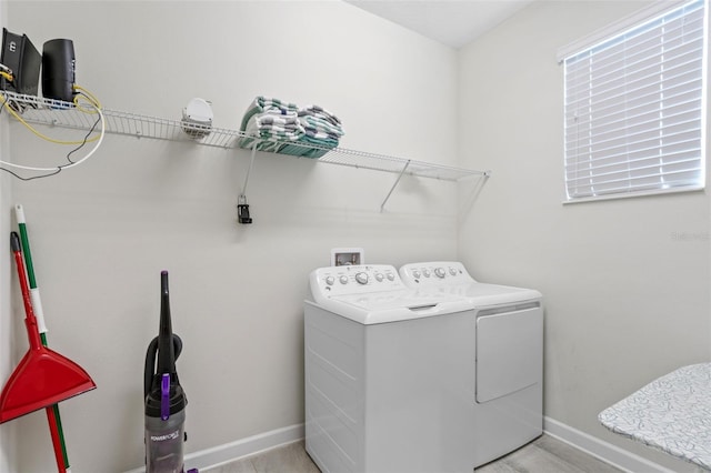 1551 Flange Dr, Davenport, FL 33896 - laundry area with baseboards, laundry area, and washing machine and clothes dryer
