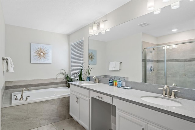 1551 Flange Dr, Davenport, FL 33896 - bathroom featuring a sink, a garden tub, a stall shower, and double vanity