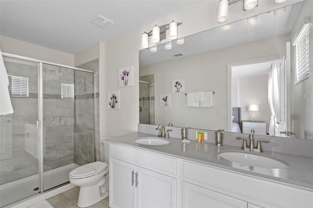 1551 Flange Dr, Davenport, FL 33896 - ensuite bathroom with tile patterned flooring, double vanity, a stall shower, and a sink