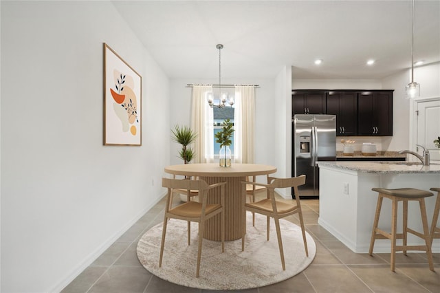 dining area with light tile patterned floors, recessed lighting, baseboards, and a chandelier