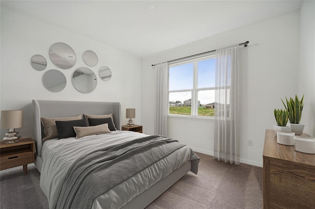 bedroom with carpet and baseboards
