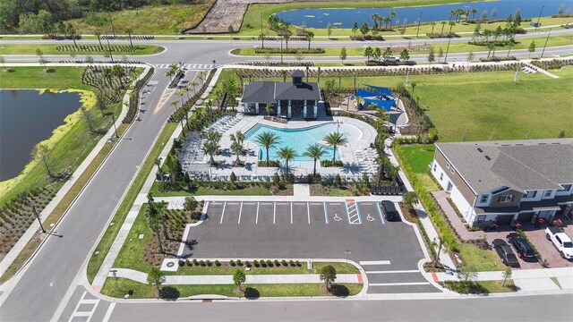 4911 Shady Pines Dr, Saint Cloud, FL 34772 - drone / aerial view of a pool and a large body of water