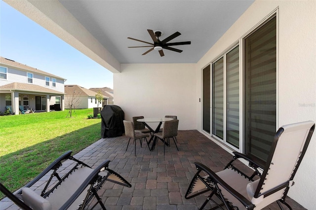 4911 Shady Pines Dr, Saint Cloud, FL 34772 - view of patio with a ceiling fan, grilling area, and outdoor dining area