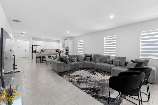 4911 Shady Pines Dr, Saint Cloud, FL 34772 - living area featuring recessed lighting and light tile patterned floors
