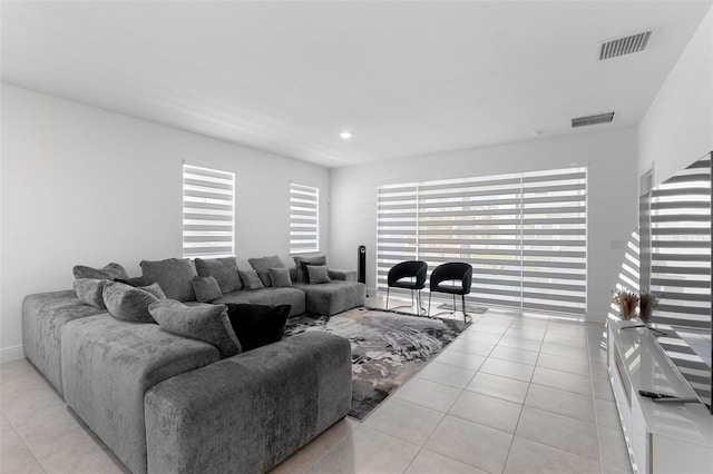 4911 Shady Pines Dr, Saint Cloud, FL 34772 - living area featuring light tile patterned floors and recessed lighting