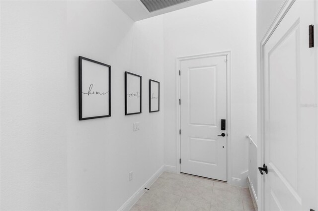 4911 Shady Pines Dr, Saint Cloud, FL 34772 - hallway with baseboards and light tile patterned flooring