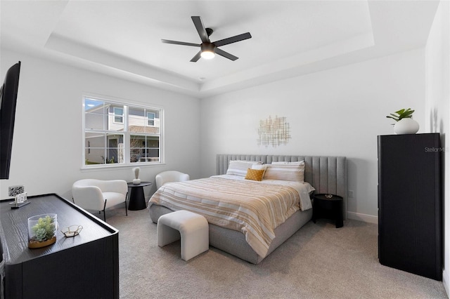 4911 Shady Pines Dr, Saint Cloud, FL 34772 - carpeted bedroom with a raised ceiling, a ceiling fan, and baseboards